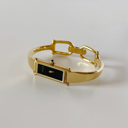 Gucci 1990s Black Rectangular Dial Gold Plated Bangle Watch