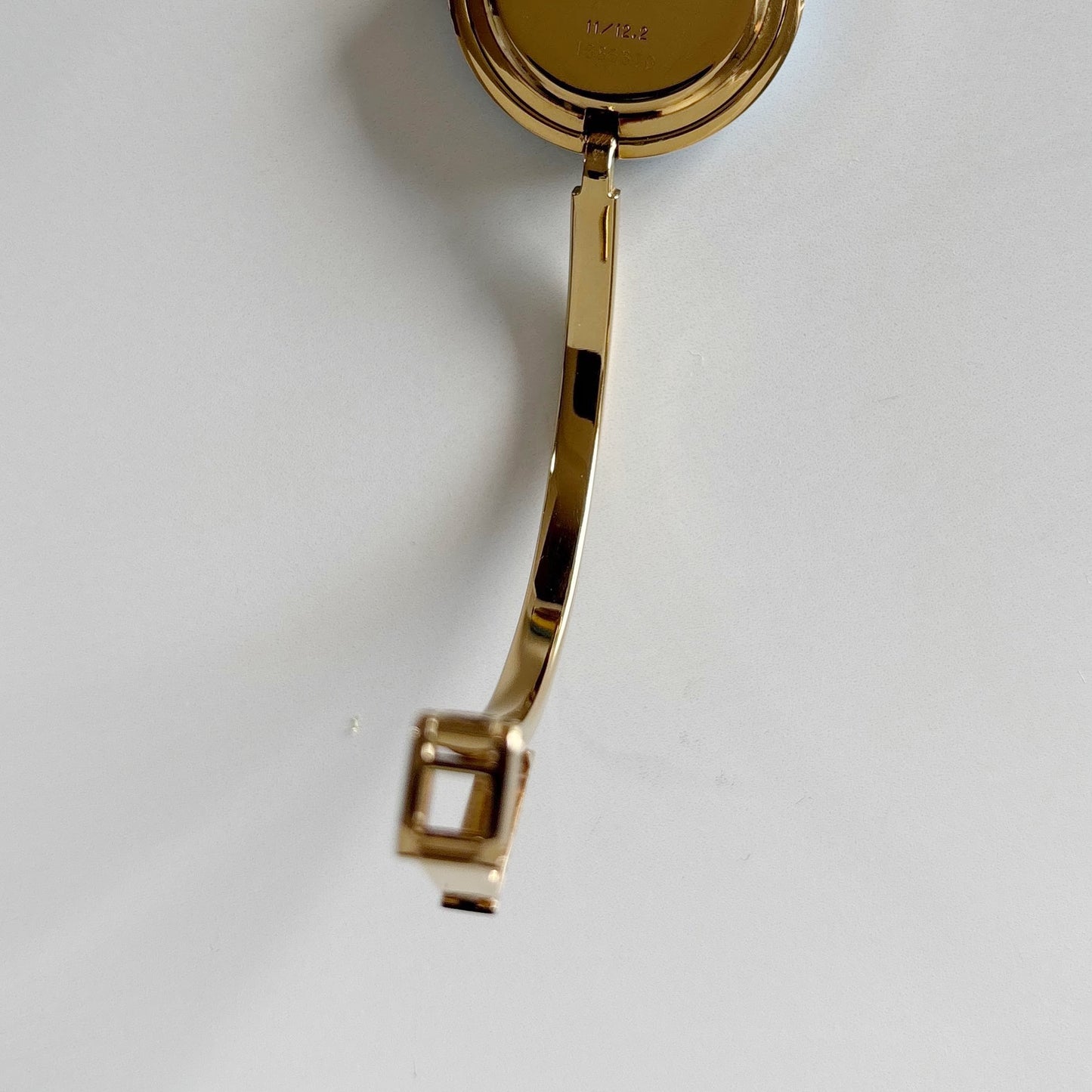 Gucci 1990s Interchangeable Bezel Gold Plated Bangle Watch with 12 bezels, case