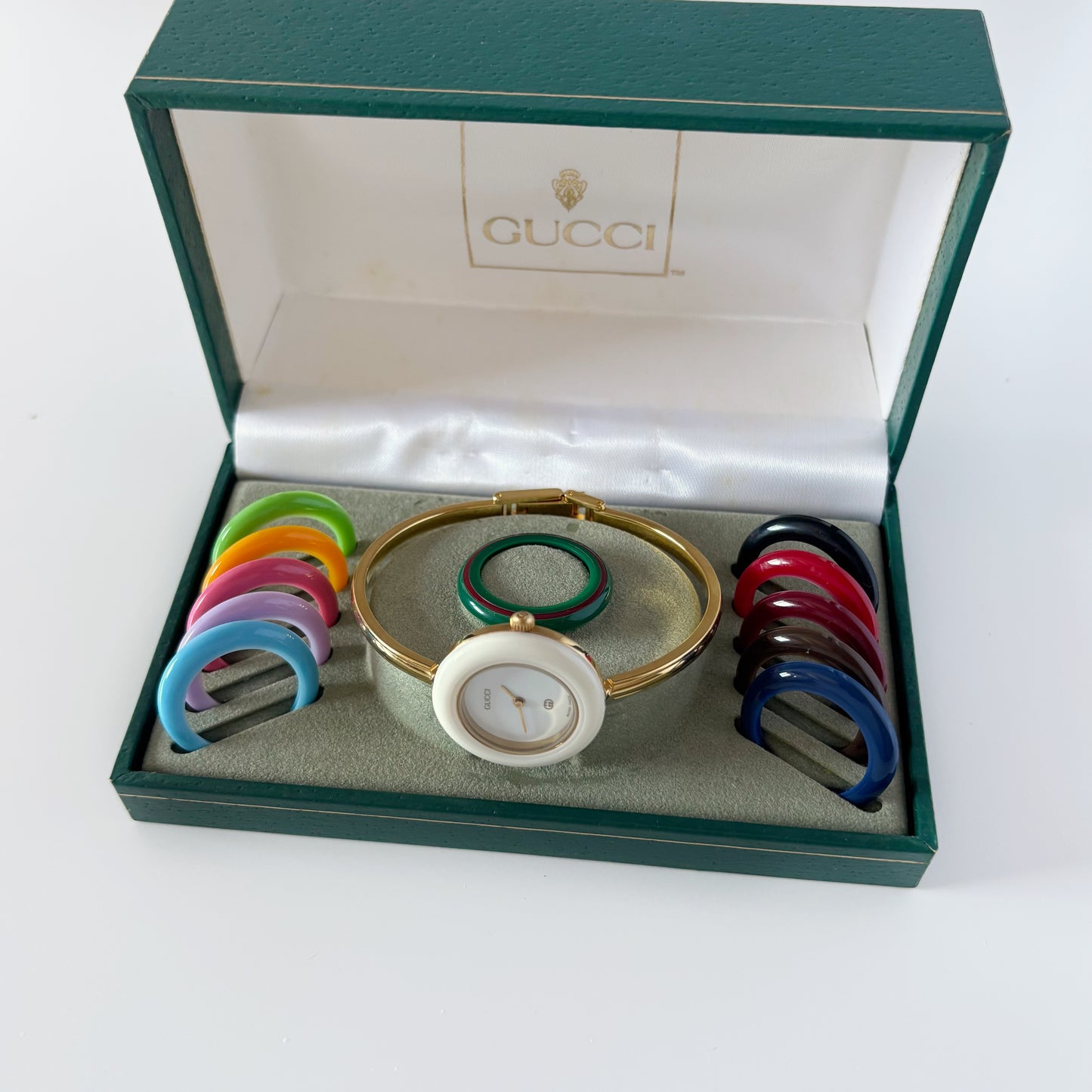Gucci 1990s Interchangeable Bezel Gold Plated Bangle Watch with 12 bezels, case