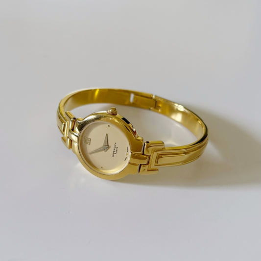 Givenchy 1990s Gold Plated Round Bangle Watch