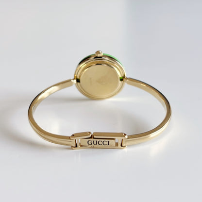 Gucci 1990s Interchangeable Bezel Gold Plated Bangle Watch with 12 bezels, case