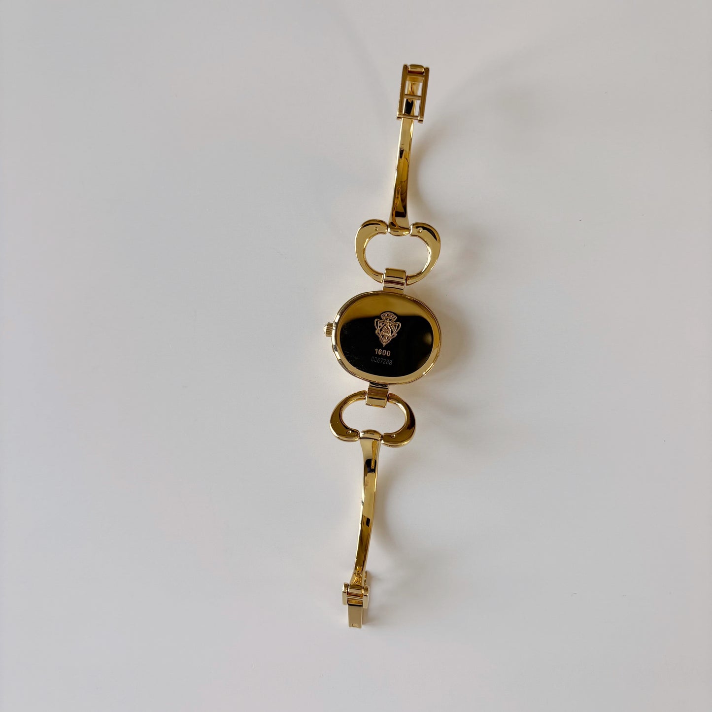Gucci 1990s Oval Gold Dial Gold Plated Bangle Watch (Small)