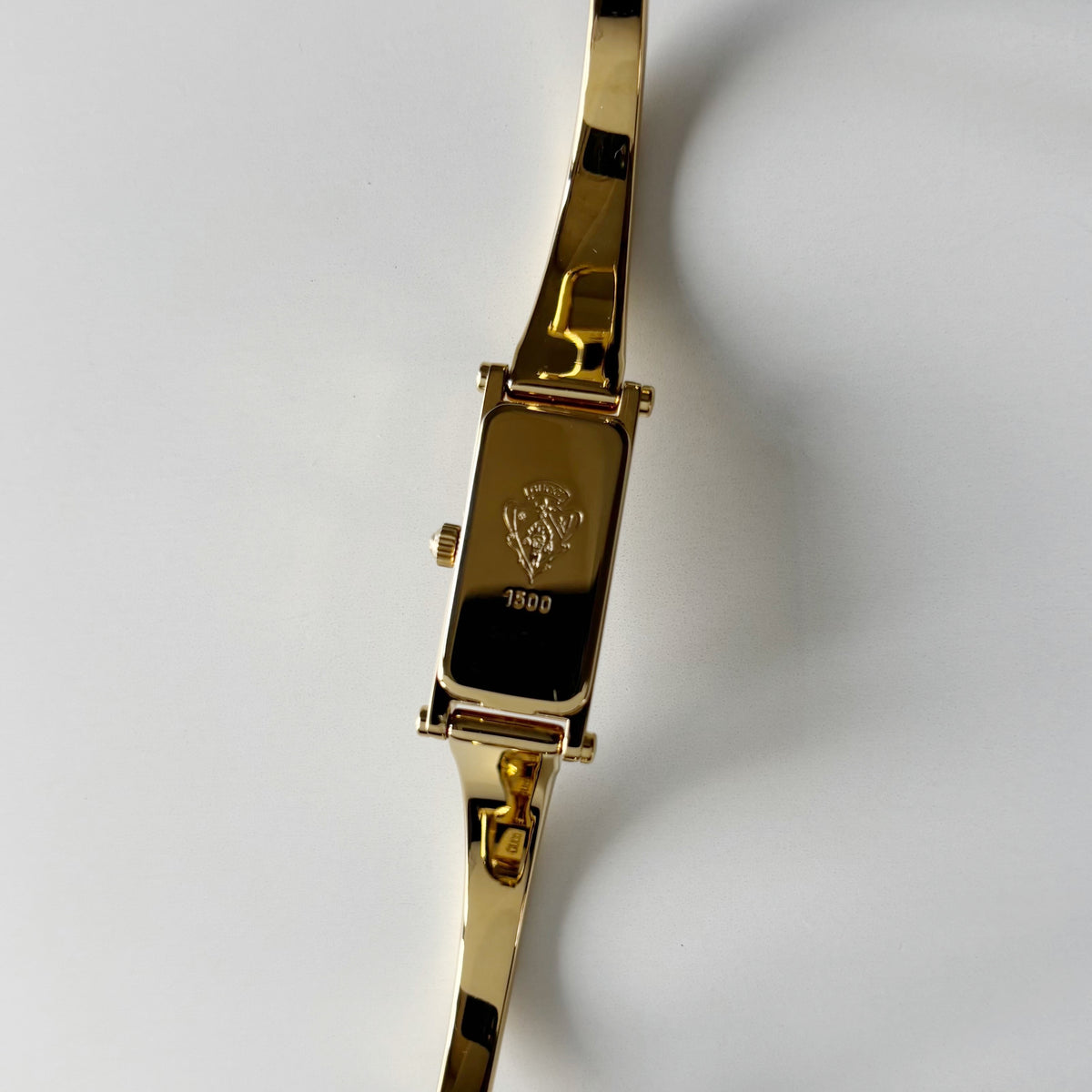 Gucci 1990s Rectangular Gold Dial Gold Plated Bangle Watch (Small)
