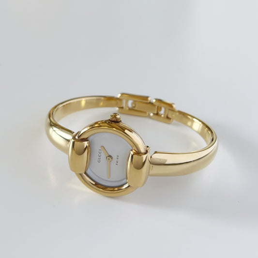 Gucci 1990s Round Dial Gold Plated Bangle Watch