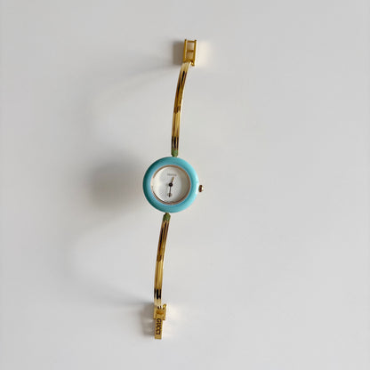 Gucci 1990s Interchangeable Bezel Gold Plated Bangle Watch with 12 bezels, case