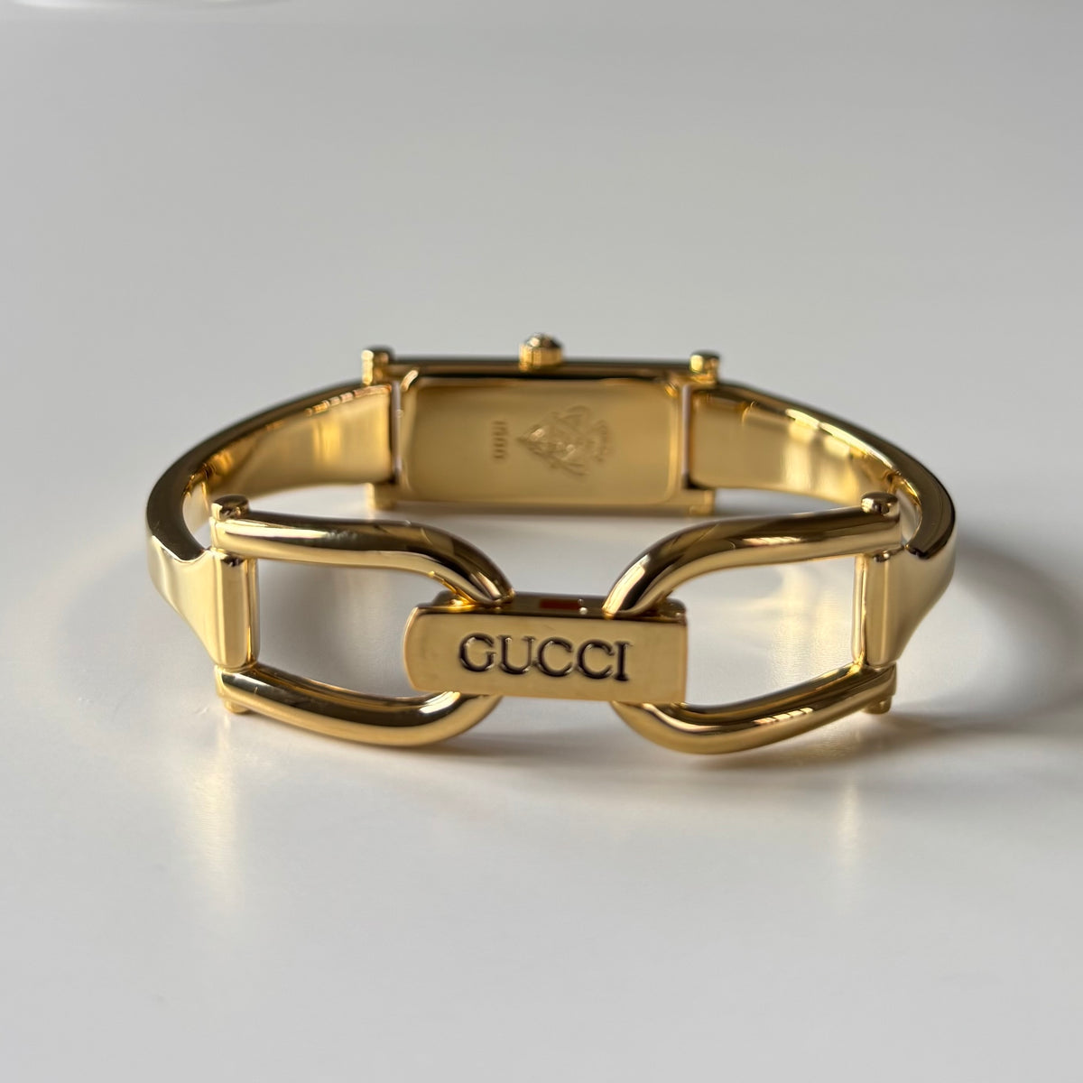 Gucci 1990s Rectangular Gold Dial Gold Plated Bangle Watch (Small)