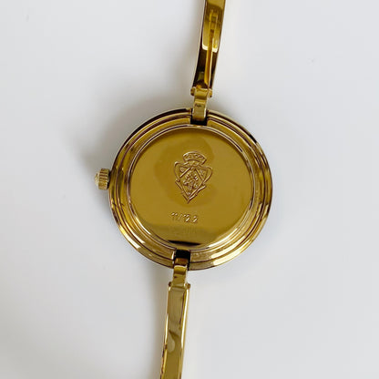 Gucci 1990s Interchangeable Bezel Gold Plated Bangle Watch with 12 bezels, case