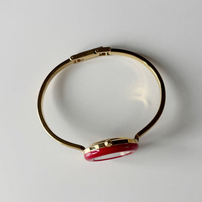 Gucci 1990s Interchangeable Bezel Gold Plated Bangle Watch with 12 bezels, case