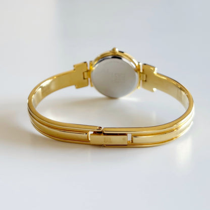 Givenchy 1990s Navy Round Dial Gold Plated Bangle Watch