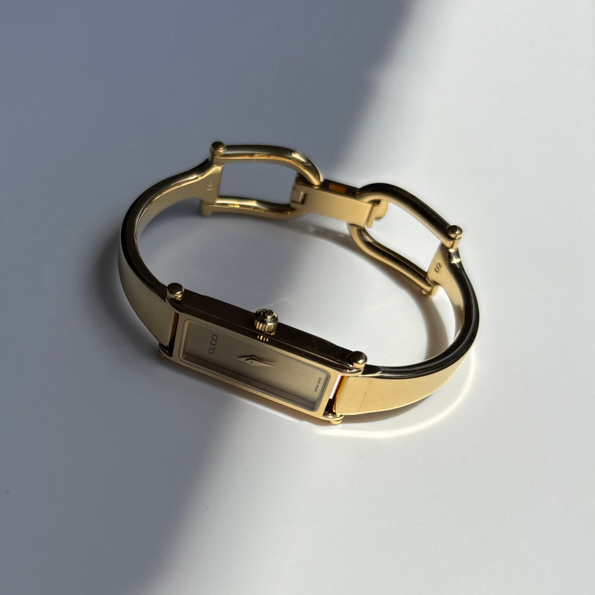 Gucci 1990s Rectangular Gold Dial Gold Plated Bangle Watch (Small)