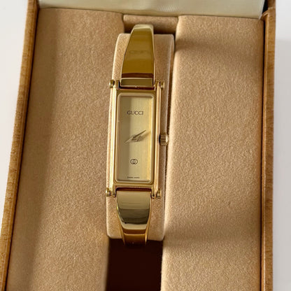 Gucci 1980s Rectangular Gold Dial Gold Plated Bangle Watch