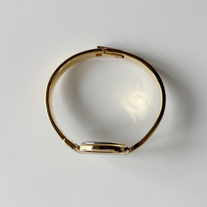 Givenchy 1990s Round Dial Gold Plated Bangle Watch