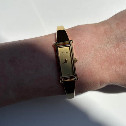 Gucci 1990s Gold Rectangular Dial Gold Plated Bangle Watch