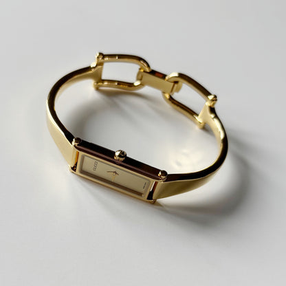Gucci 1990s Gold Rectangular Dial Gold Plated Bangle Watch