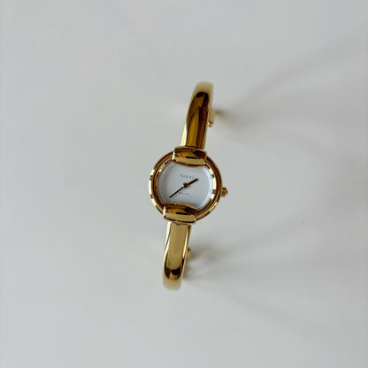 Gucci 1990s Round Dial Gold Plated Bangle Watch