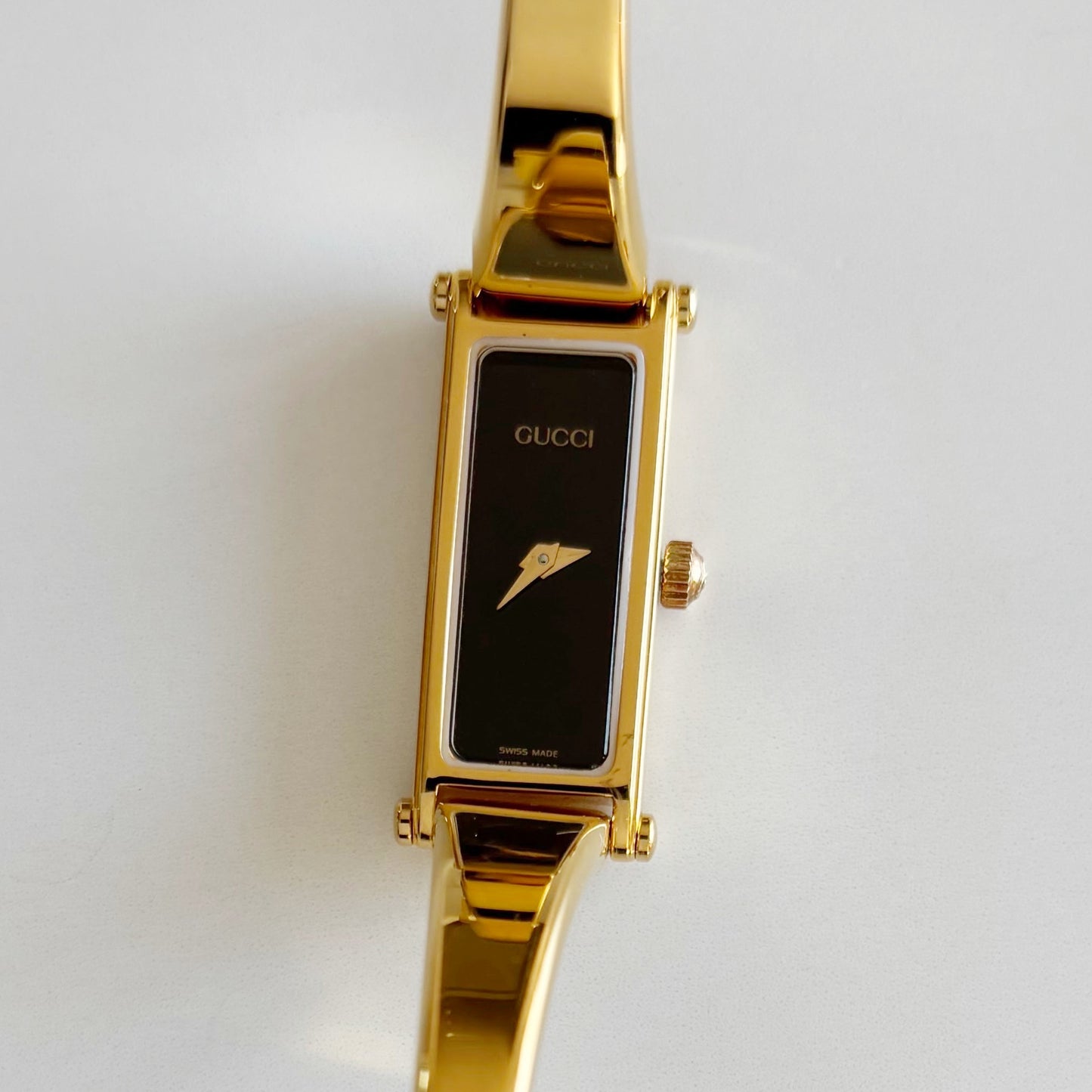 Gucci 1990s Black Rectangular Dial Gold Plated Bangle Watch
