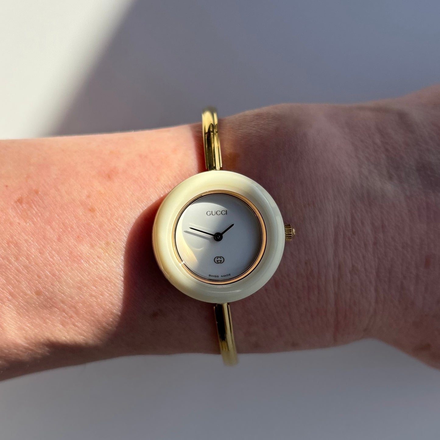 Gucci 1990s Interchangeable Bezel Gold Plated Bangle Watch with 12 bezels, case