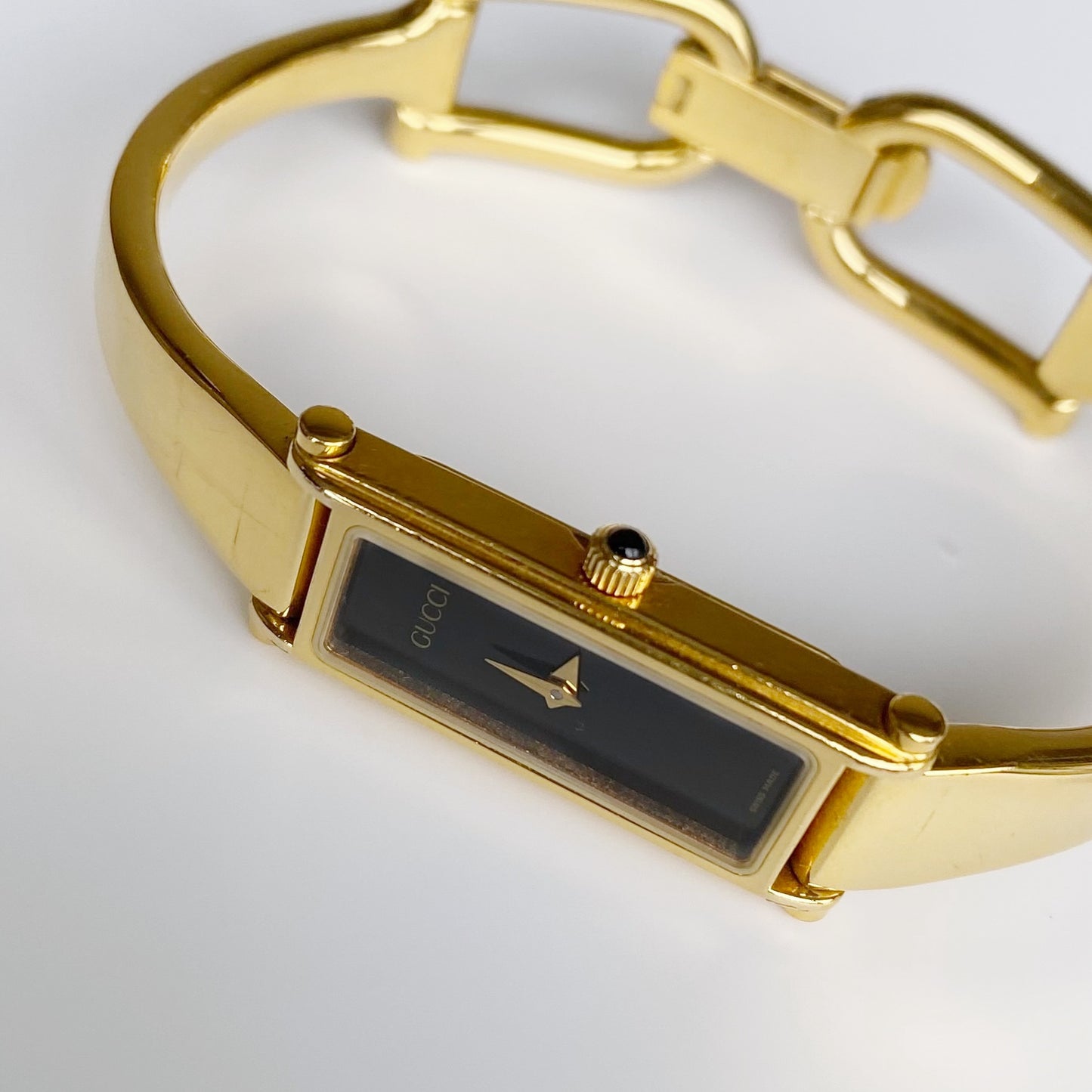 Gucci 1990s Black Dial Rectangular Gold Plated Bangle Watch