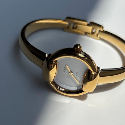 Gucci 1990s Round Dial Gold Plated Bangle Watch