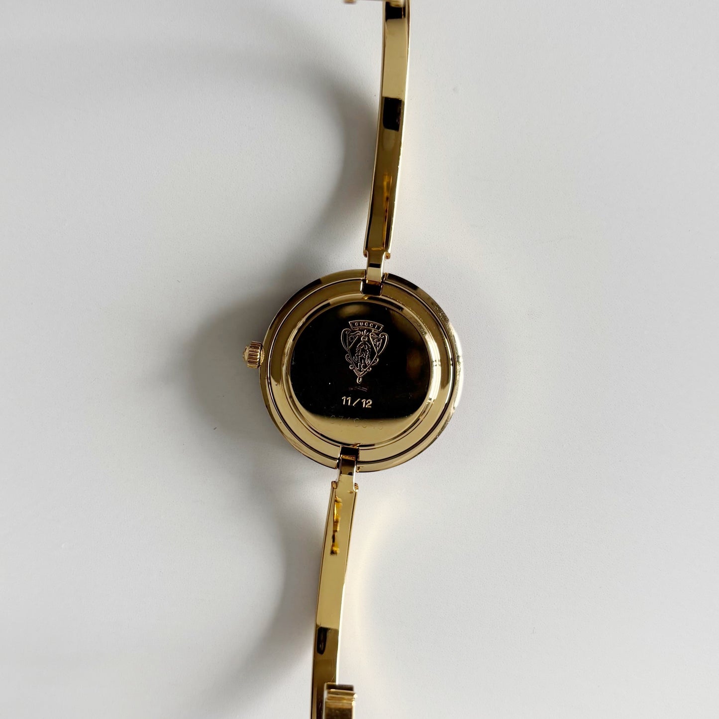 Gucci 1990s Interchangeable Bezel Gold Plated Bangle Watch with 12 bezels, case