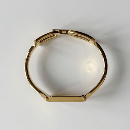 Gucci 1990s Gold Rectangular Dial Gold Plated Bangle Watch