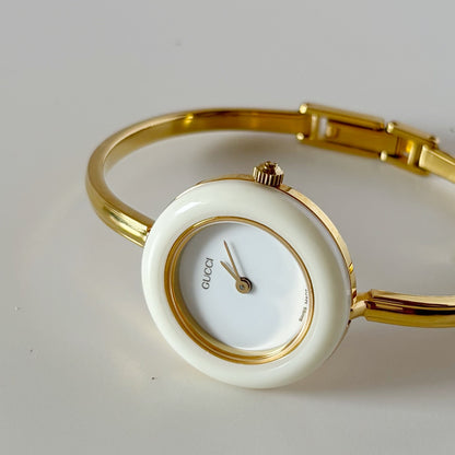 Gucci 1990s Interchangeable Bezel Gold Plated Bangle Watch with 12 bezels, case