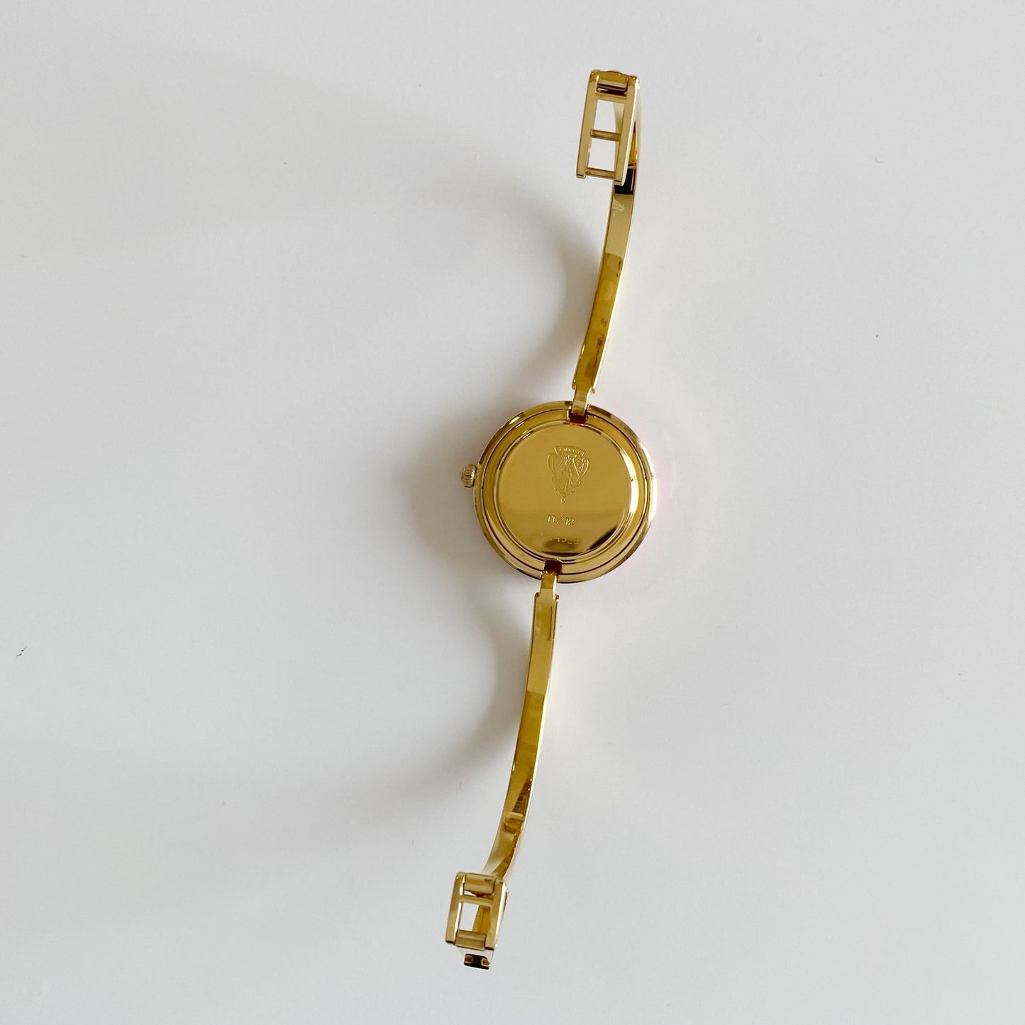 Gucci 1990s Interchangeable Bezel Gold Plated Bangle Watch with 12 bezels, case
