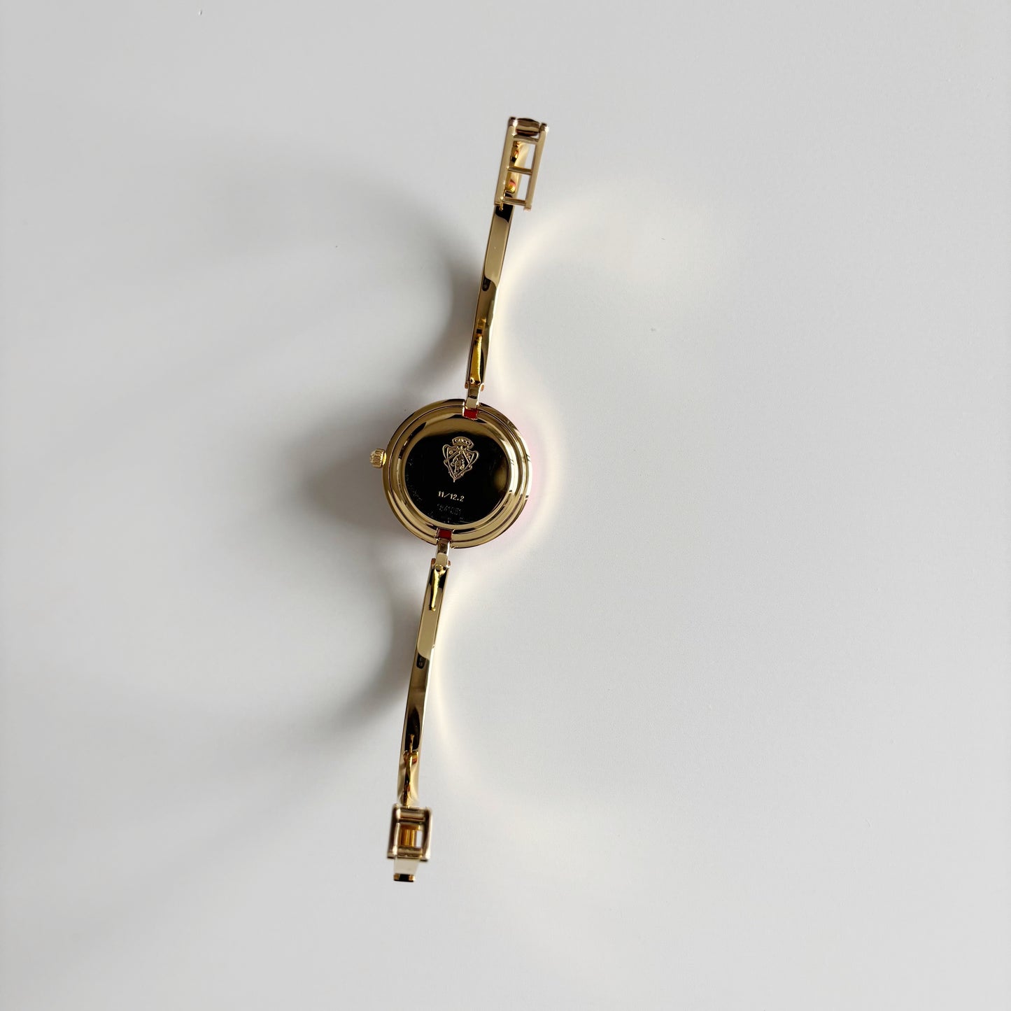 Gucci 1990s Interchangeable Bezel Gold Plated Bangle Watch with 12 bezels, case