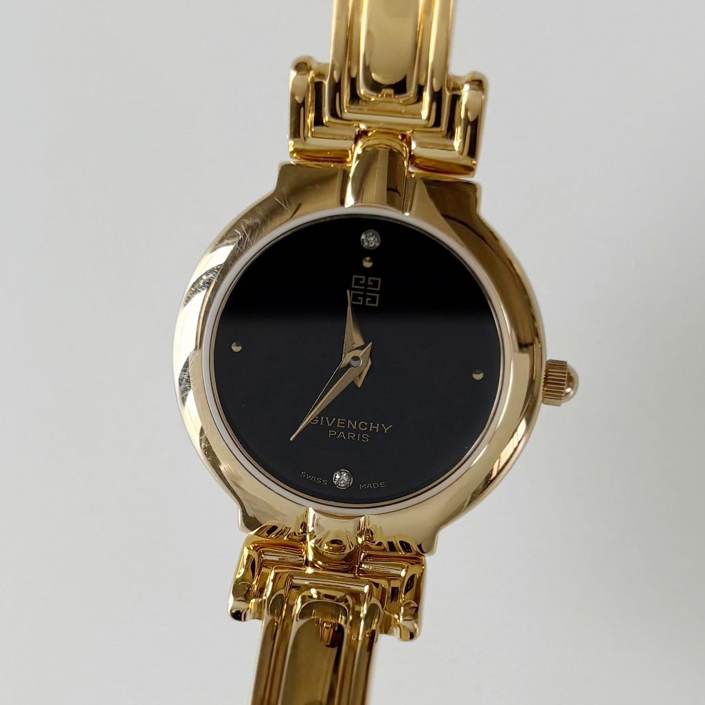 Givenchy 1990s Black Round Dial Gold Plated Bangle Watch