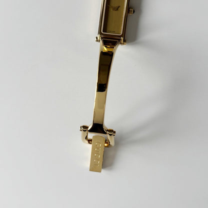 Gucci 1990s Gold Rectangular Dial Gold Plated Bangle Watch