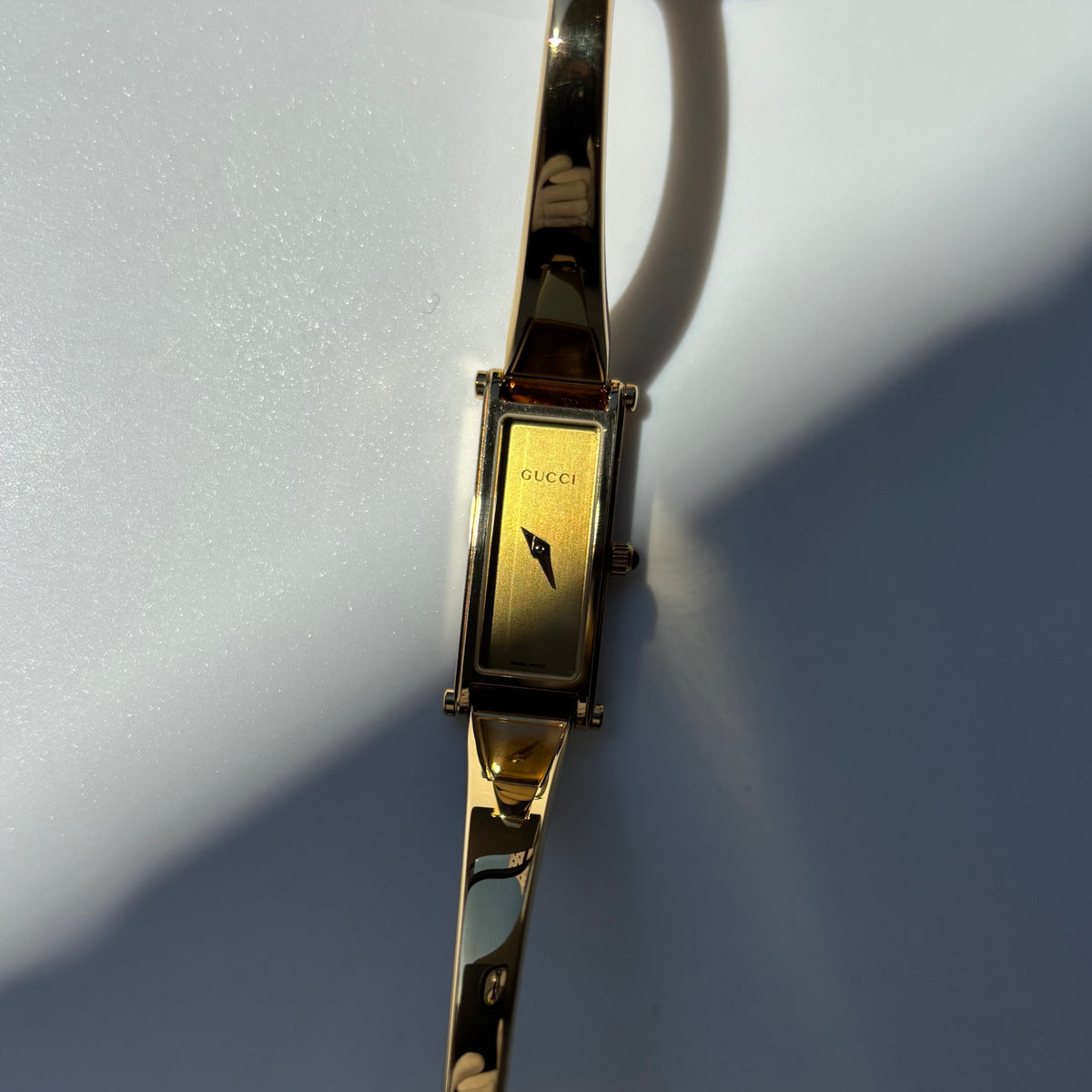 Gucci 1990s Rectangular Gold Dial Gold-Plated Watch
