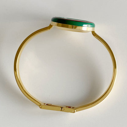 Gucci 1990s Interchangeable Bezel Gold Plated Bangle Watch with 12 bezels, case