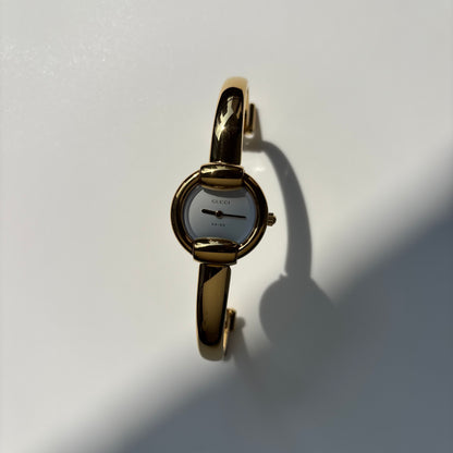Gucci Round Dial Gold-Plated Bangle Watch