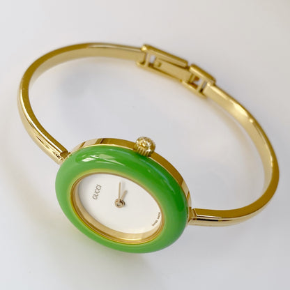 Gucci 1990s Interchangeable Bezel Gold Plated Bangle Watch with 12 bezels, Case