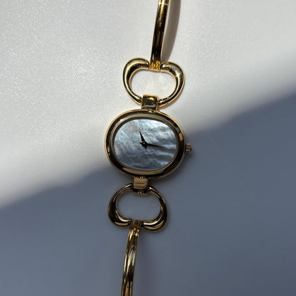 Gucci 1990s Seashell Oval Dial Gold Plated Bangle Watch (Small)
