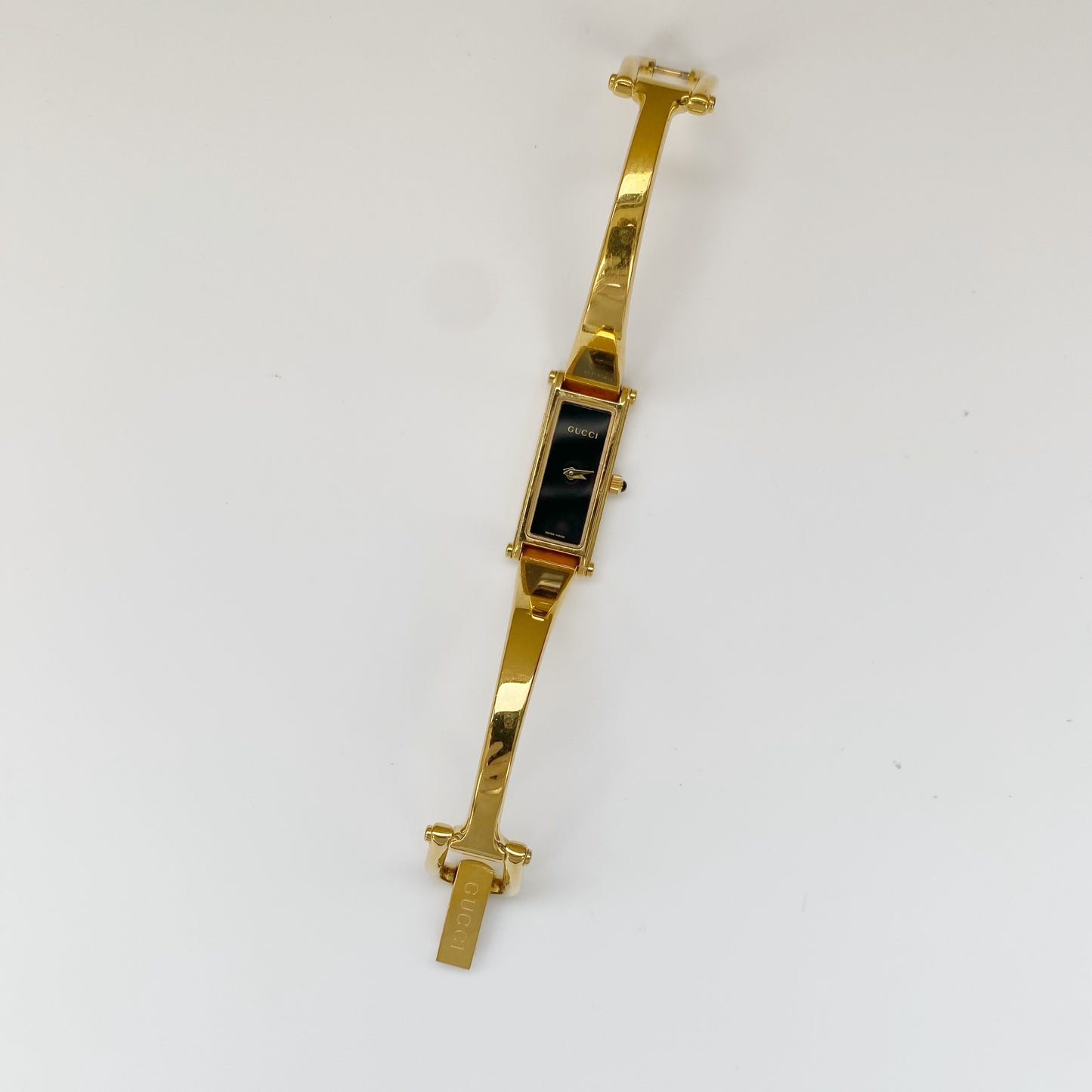 Gucci 1990s Black Dial Gold Plated Rectangular Bangle Watch