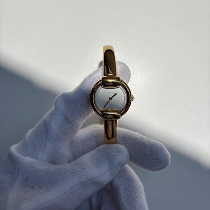 Gucci 1990s Round Dial Gold Plated Bangle Watch