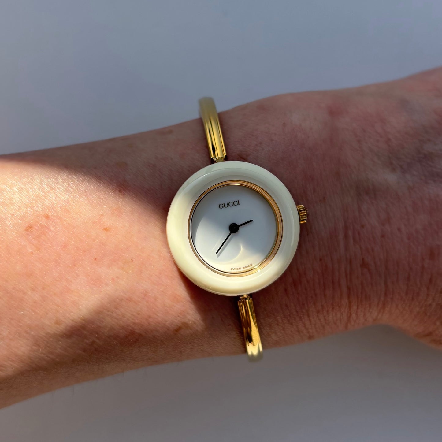 Gucci 1990s Interchangeable Bezel Gold Plated Bangle Watch with 12 bezels, case