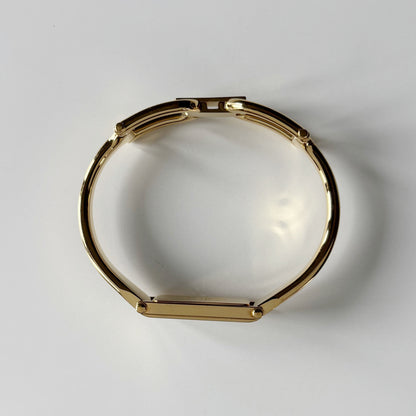 Gucci 1990s Gold Rectangular Dial Gold Plated Bangle Watch