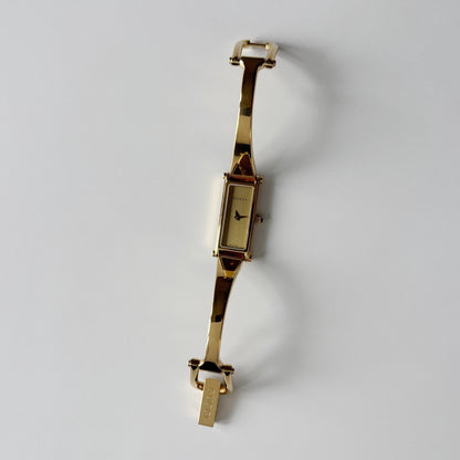 Gucci 1990s Gold Rectangular Dial Gold Plated Bangle Watch (Small)