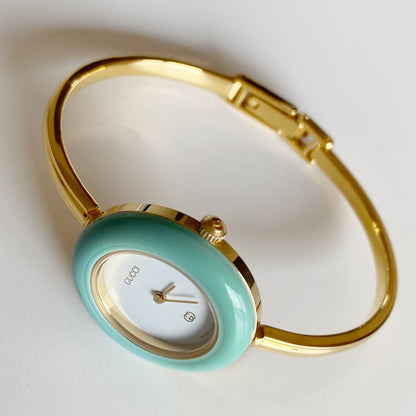 Gucci 1990s Interchangeable Bezel Gold Plated Bangle Watch with 12 bezels, case