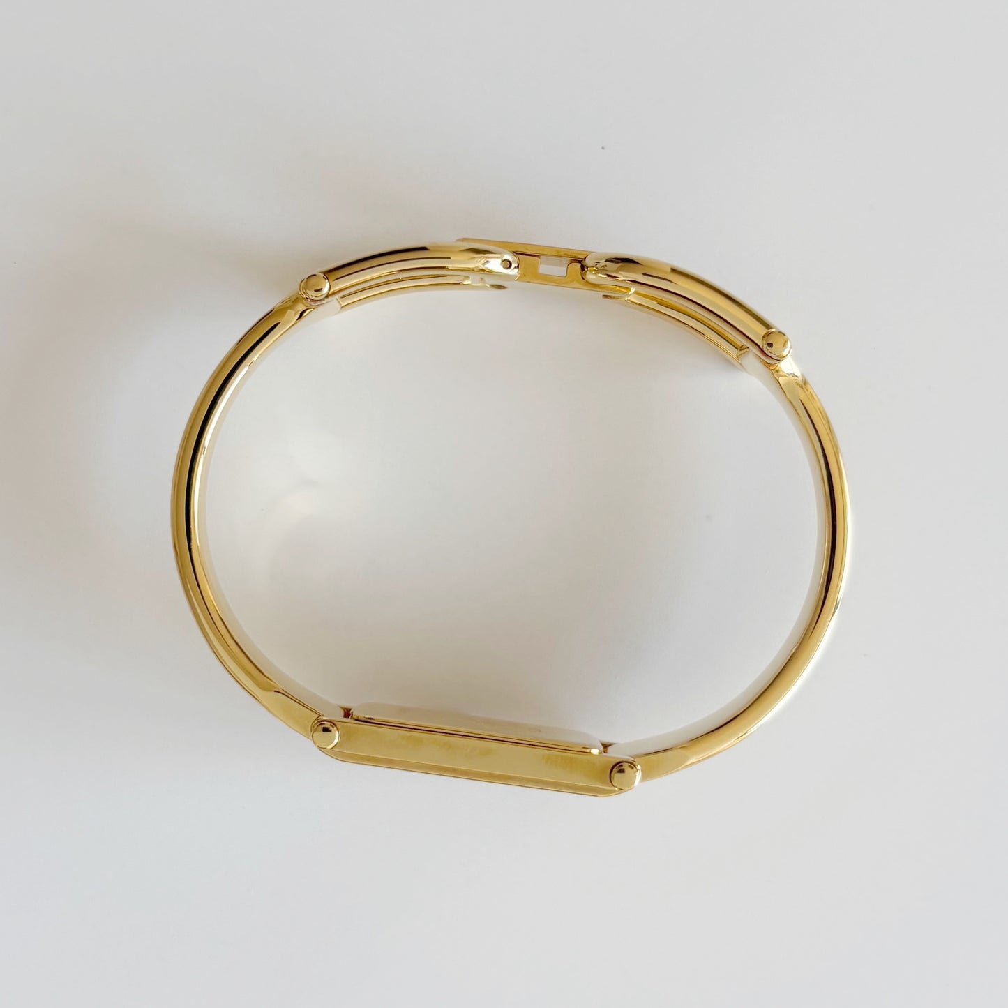 Gucci 1990s Rectangular Gold Dial Gold Plated Bangle Watch