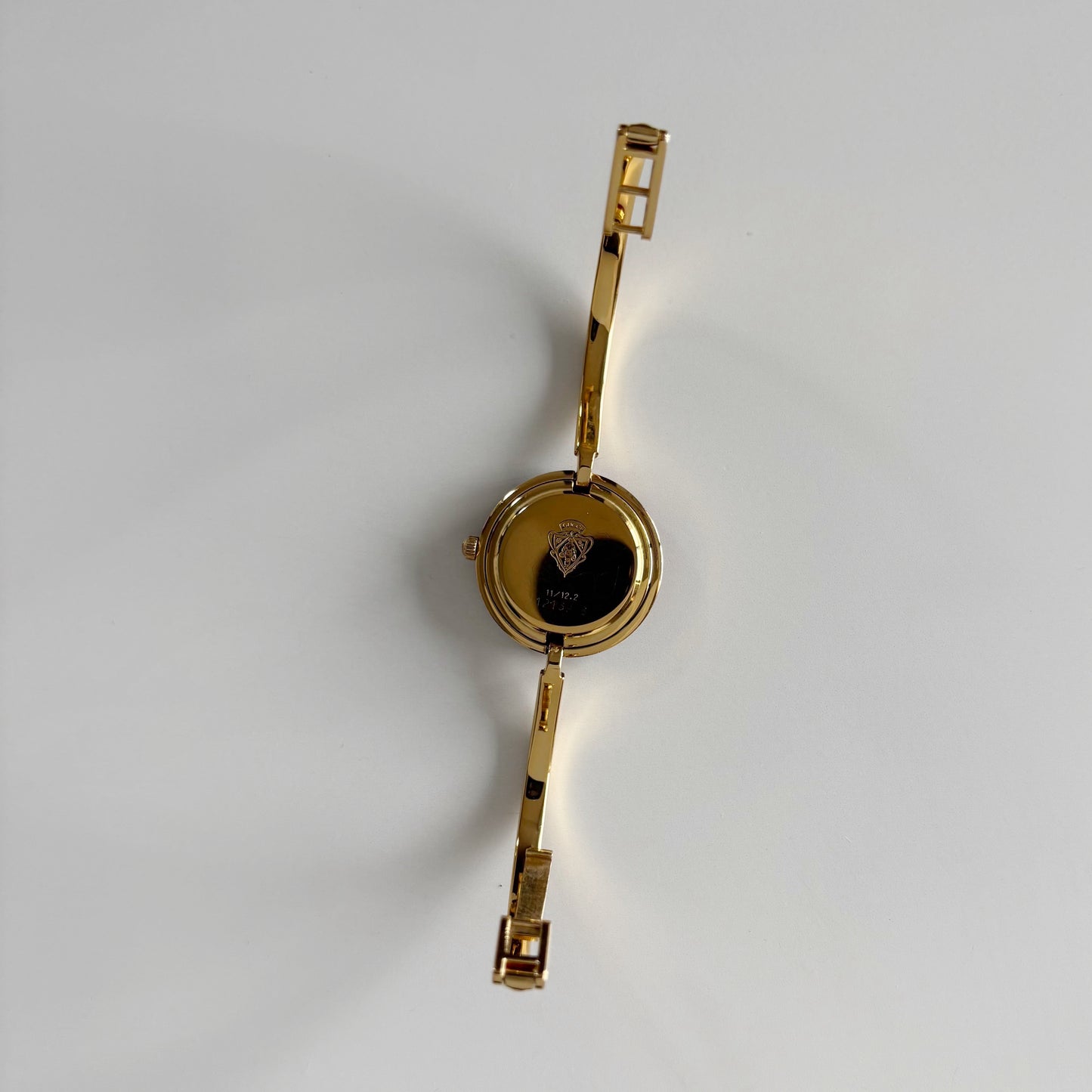 Gucci 1990s Interchangeable Bezel Gold Plated Bangle Watch with 12 bezels, case