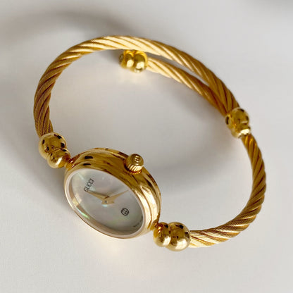 Gucci 1990s Seashell Dial Gold Plated Cable Bangle Watch