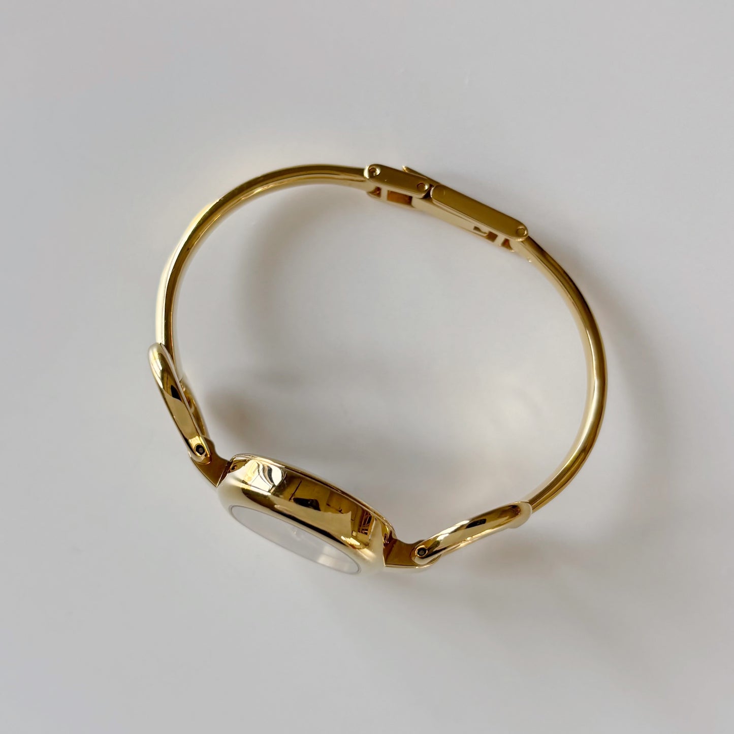 Gucci 1990s Oval Gold Dial Gold Plated Bangle Watch (Small)