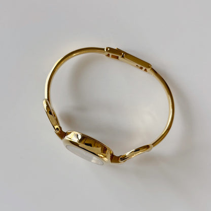 Gucci 1990s Oval Gold Dial Gold Plated Bangle Watch (Small)