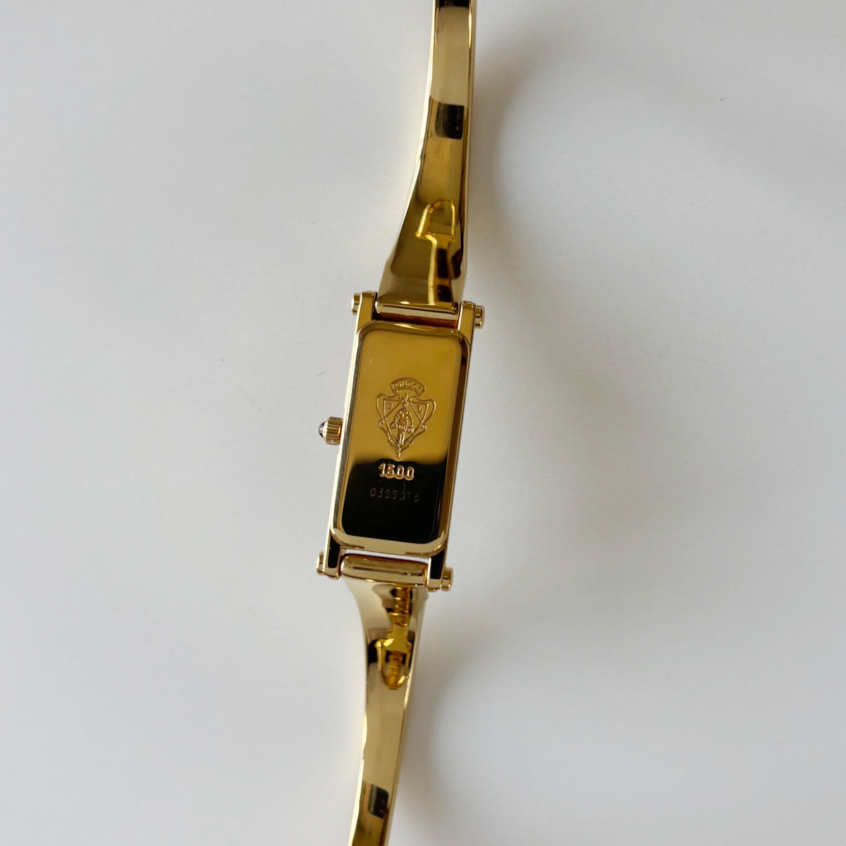 Gucci 1990s Rectangular Gold Dial Gold Plated Bangle Watch