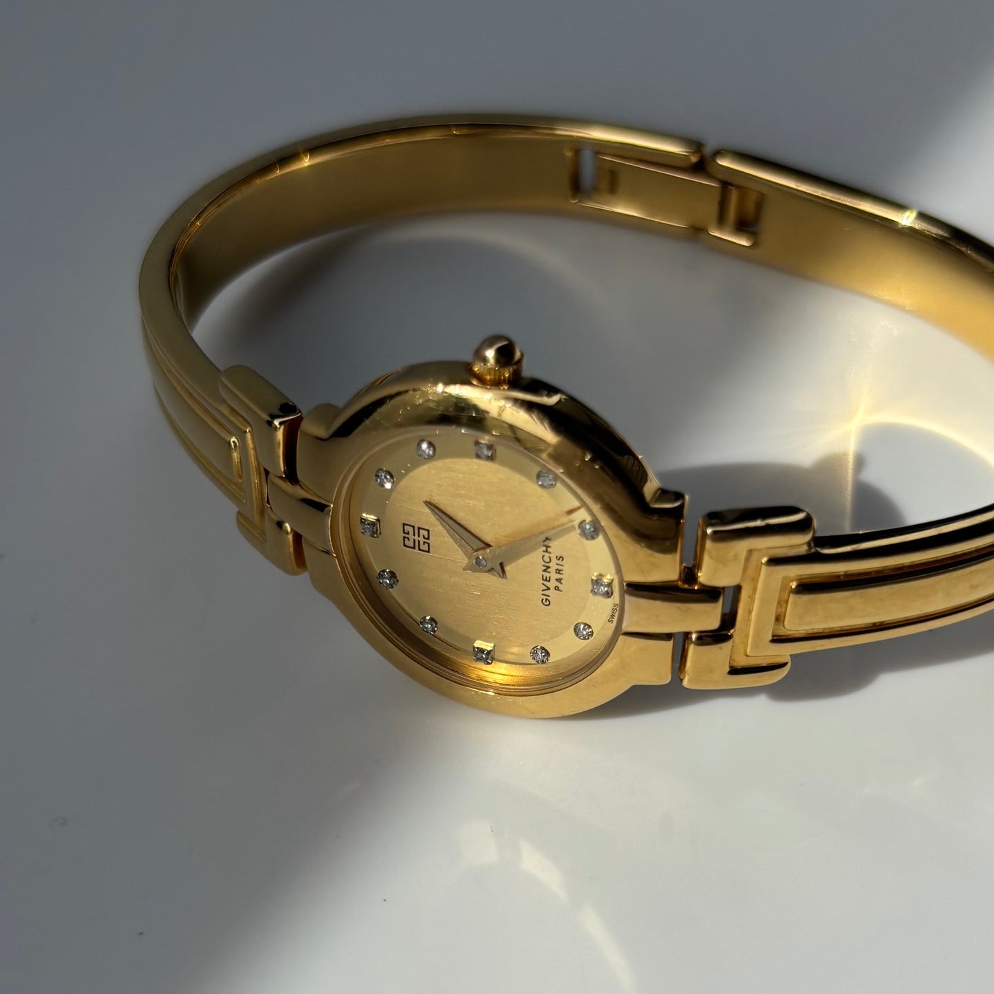 Givenchy 1990s Round Dial Gold Plated Bangle Watch