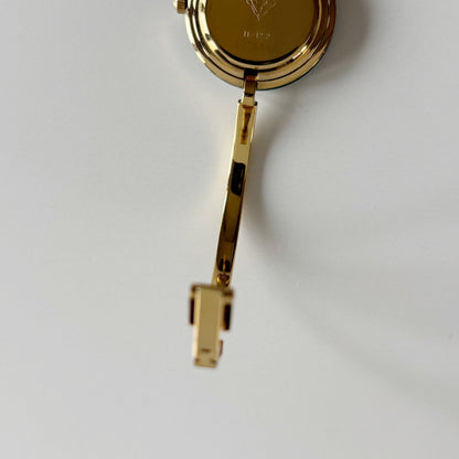 Gucci 1990s Interchangeable Bezel Gold Plated Bangle Watch with 12 bezels, case