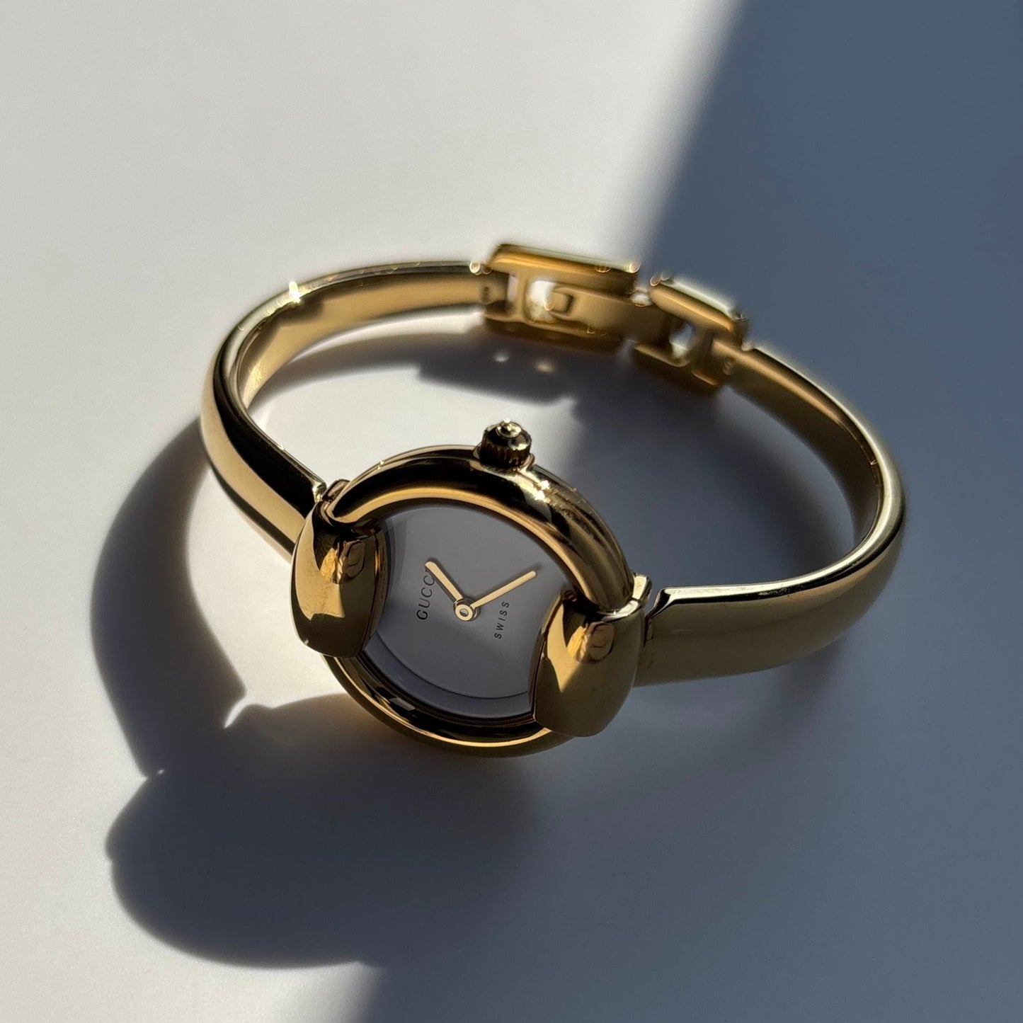 Gucci 1990s Round Dial Gold Plated Bangle Watch (Small)